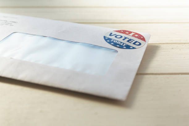 istock Envelope containing voting ballot papers being sent by mail for absentee vote in presidential election 1280952224