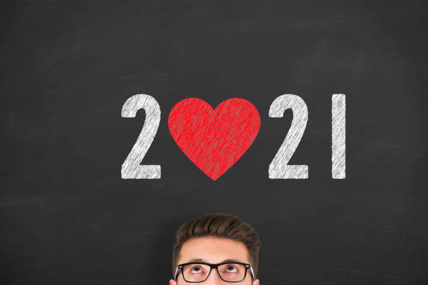 istock New Year 2021 with Heart Shape on Chalkboard Background 1280953636