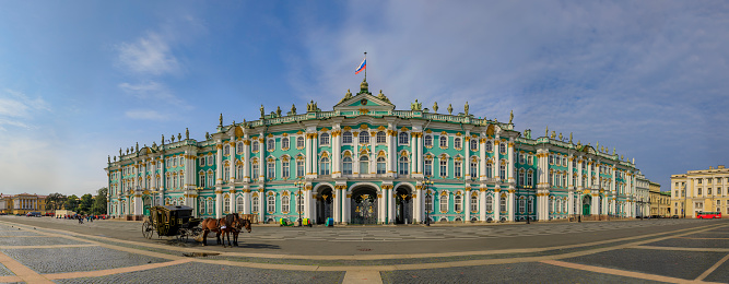 Saint Petersburg, Russia - September 10, 2017: Panorama of the Winter Palace Hermitage on Palace Square with a horse carriage awaiting tourists