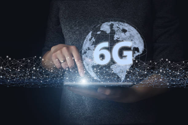 istock Hand hold tablet with gologram eart and 6G. Creative connection background, a new generation network has a wireless speed limit mixed media. 6G network wireless systems. Futuristic concept. 1280954916