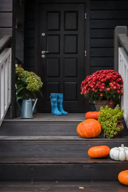 Photo of Traditional style porch, front steps decoration at Halloween, Thanksgiving season