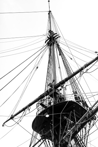 Black and white Old Tall ship mast, low angle view, background with copy space, full frame vertical composition