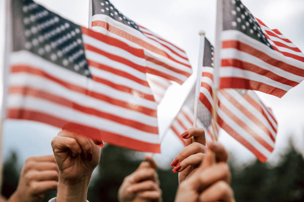 istock Crowd celebrating with national US flag 1280959252
