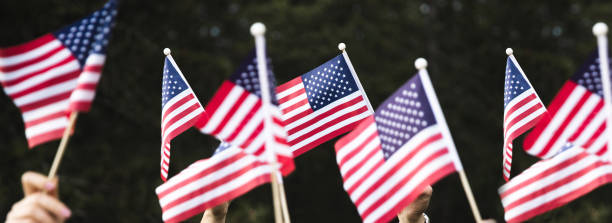 istock Crowd celebrating with national US flag 1280959326