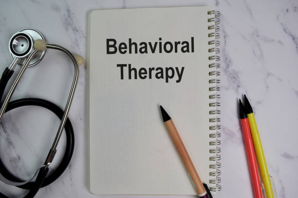 istock Book about Behavioral Therapy isolated on wooden table. 1280960200
