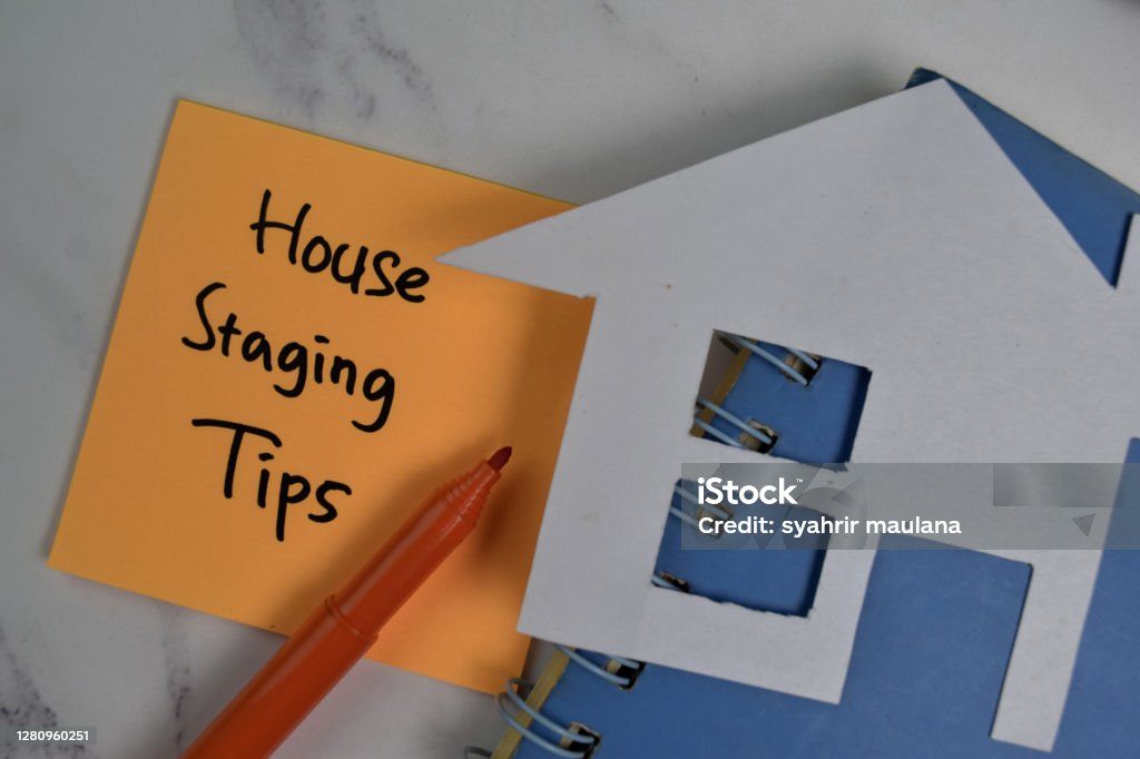 House Staging Tips write on sticky notes isolated on office desk. Home Interior Stock Photo