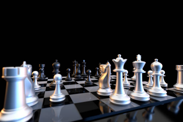 istock Close up of chessmen on chessboard isolated on black background 1280960300