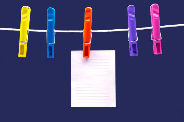 istock paper notepad for reminder hanging on colored clothespins 1280961194
