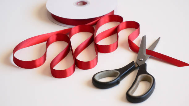 istock Surgery face mask with red ribbon as a present 1280961196