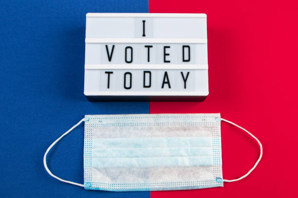 istock I voted today. Voting concept for elections, protective medical mask and sign. 1280963875