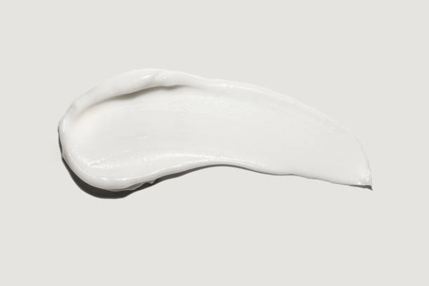 istock White foam clay cream mask sample textured foundation isolated on multi-colored background 1280965518
