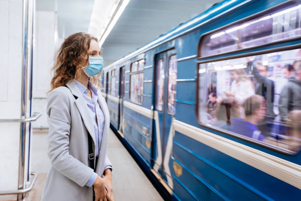 istock young woman in protective mask standing at subway station 1280971555