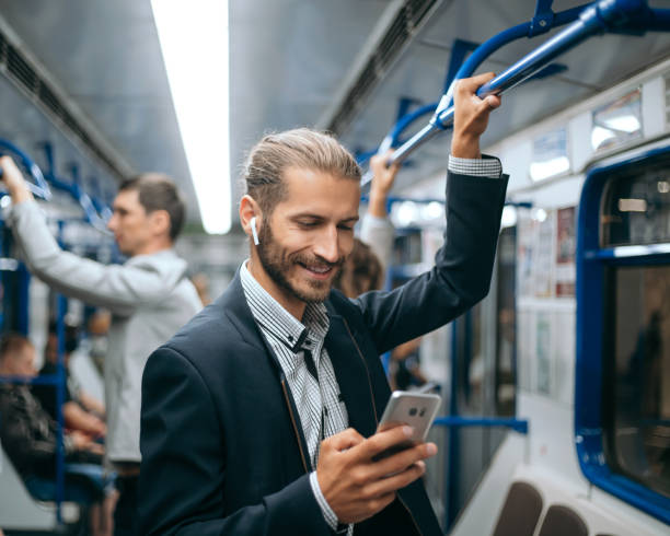 istock young man reading his correspondence in the subway 1280971627