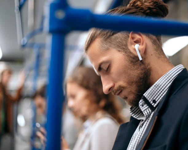 istock tired business man sleeps in a subway train car 1280971662