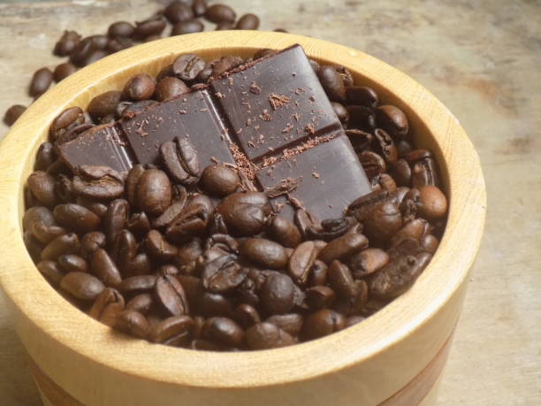 Chocolate bar among roasted coffee beans