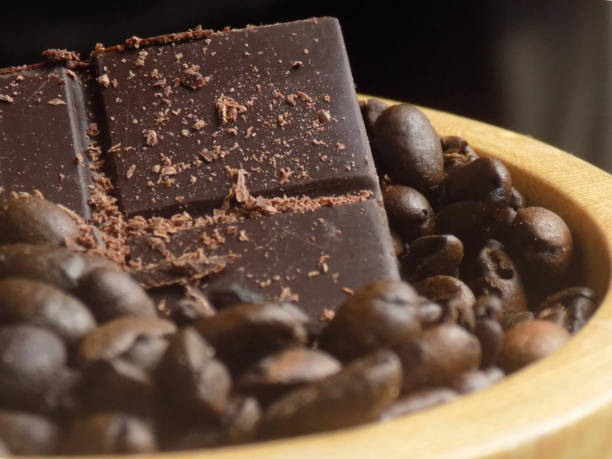 Chocolate bar between roasted coffee beans III