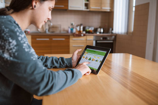istock Woman ordering fruits and vegetables online 1280973574