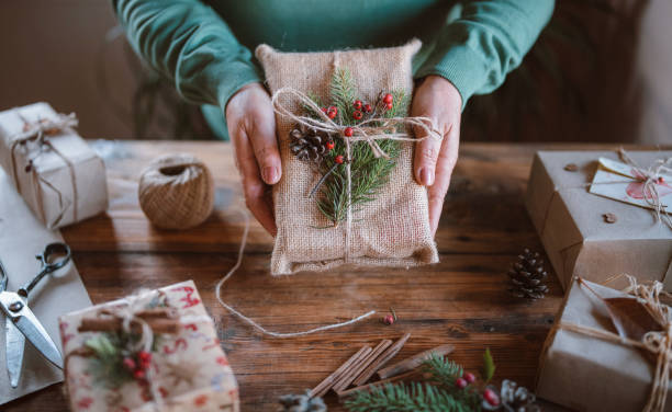 istock Cropped hands holding wrapped Christmas gift 1280973591