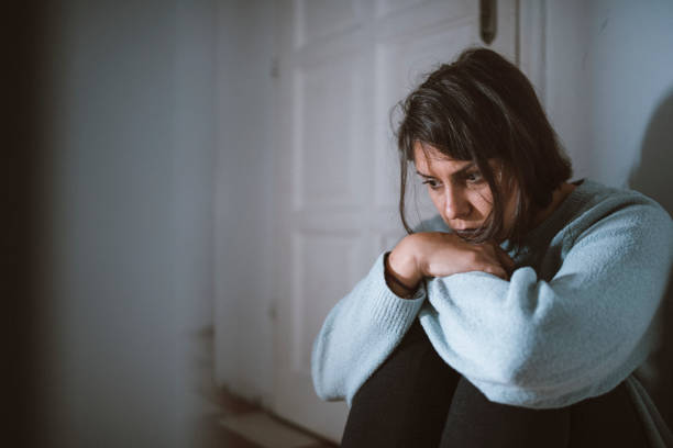 istock Sad Young Female That Struggles With Depression Is Sitting Desperately On The Floor 1280973603