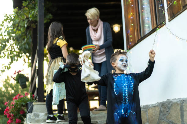 istock Kids collecting sweets at Halloween 1280973651