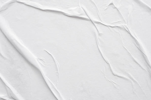 istock Blank white crumpled and creased paper poster texture background 1280973805