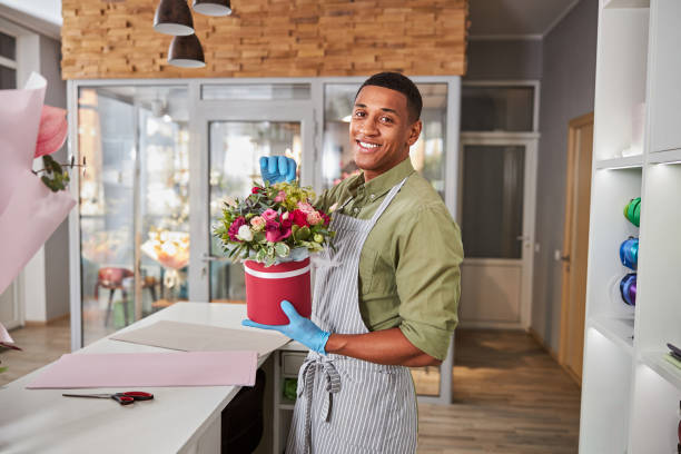 istock Cheerful shop worker ripping off some flower leaves 1280979306