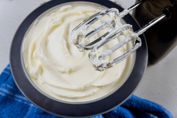 istock White butter cream in bowl with mixer whisk. 1280981814