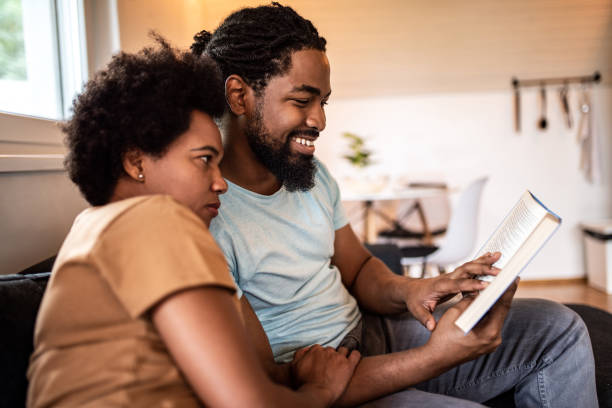 istock African American couple reading a book. 1280985331