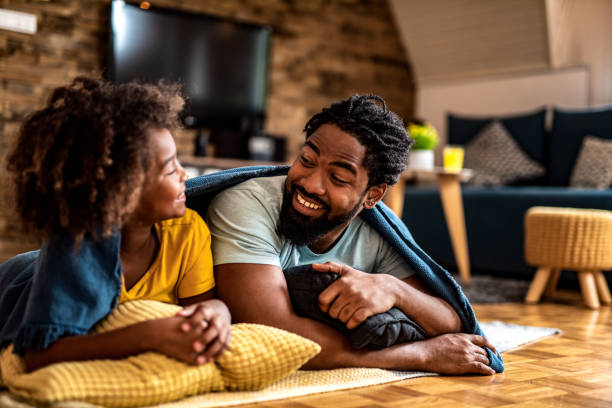 istock Happy father and daughter talking at home. 1280986094