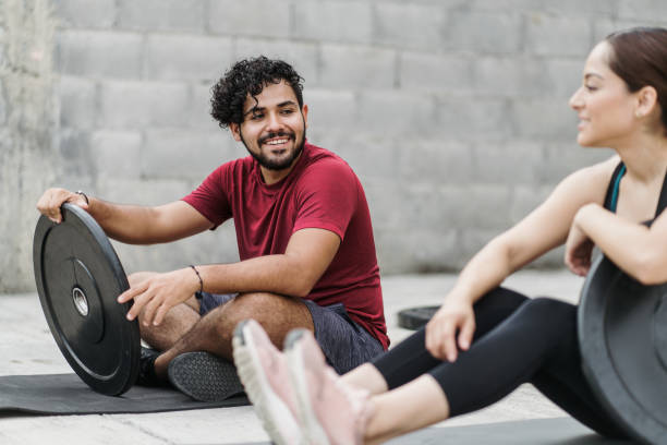 istock Latin couple taking a break during sport training at home 1280986957