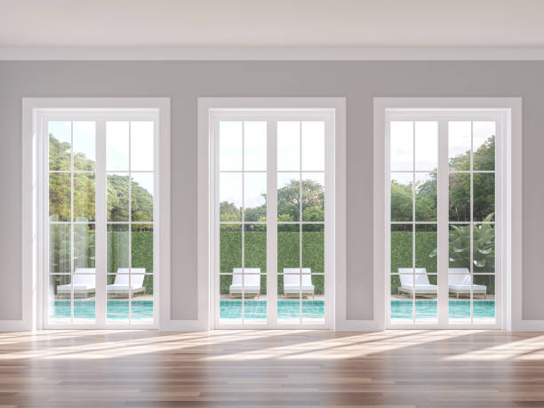 Empty classical style with swimming pool background 3d render Empty classical style with swimming pool background 3d render, The room has wood floor gray wall and white door overlooking the pool terrace and nature view. country club stock pictures, royalty-free photos & images