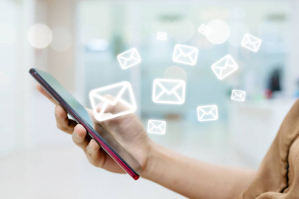 istock Hand female using smartphone with icon envelope email. Contact us customer service or e-mail marketing concept 1280988593