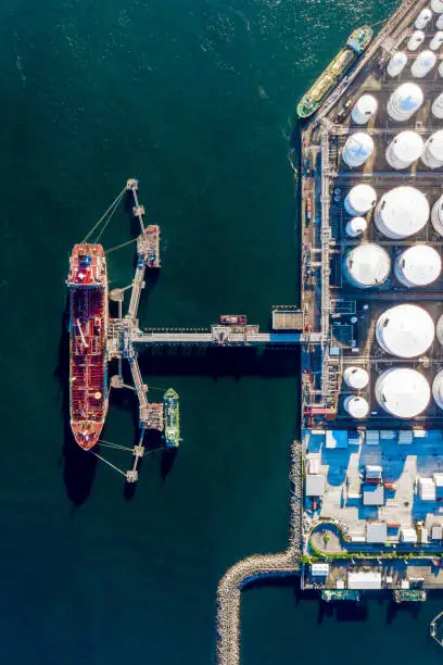 Photo of Oil terminal is industrial facility for storage of oil and gas petrochemical products ready for transport to further storage facilities