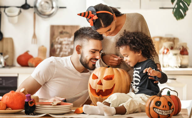 istock Happy multi ethnic family preparing for Halloween celebration 1280991005