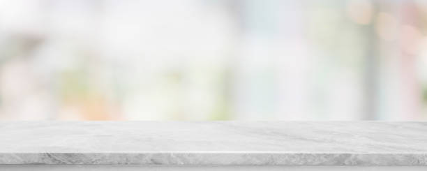 istock Empty white marble stone table top and blur glass window interior cafe and restaurant banner mock up abstract background - can used for display or montage your products. 1280991634
