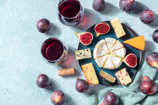 istock Wine, cheese, and fruit, a flat lay. Overhead photo of a cheese plate 1280993472