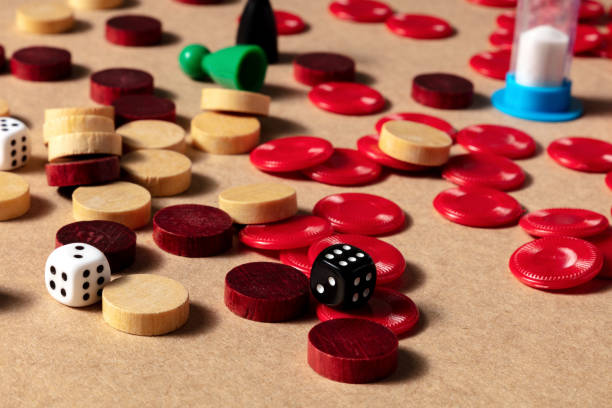 istock Board games concept, various pieces and dice, scattered on a table 1280993558