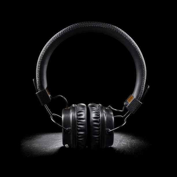 istock Wireless on-ear headphones on black background 1280994163