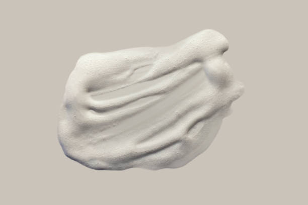Cosmetic light blue gray silky cream milk texture on white background