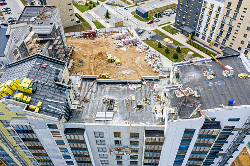 roof construction in progress. aerial view of modern building construction site