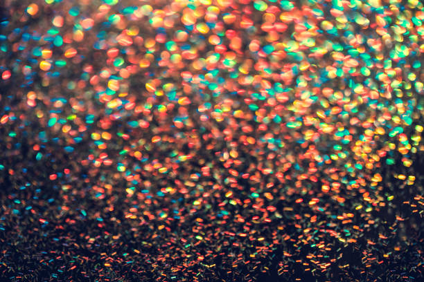 istock Festive neon lights star flares blur on black background 1281000642