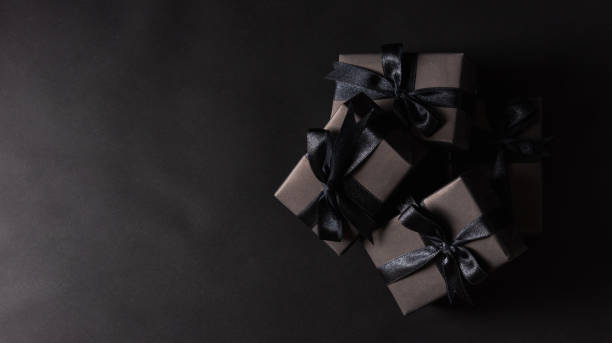 istock gift box wrapped in black paper and black bow ribbon 1281000953