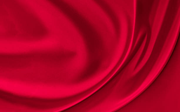 istock Black red satin dark fabric texture luxurious shiny that is abstract silk cloth background with patterns soft waves blur beautiful. 1281004912