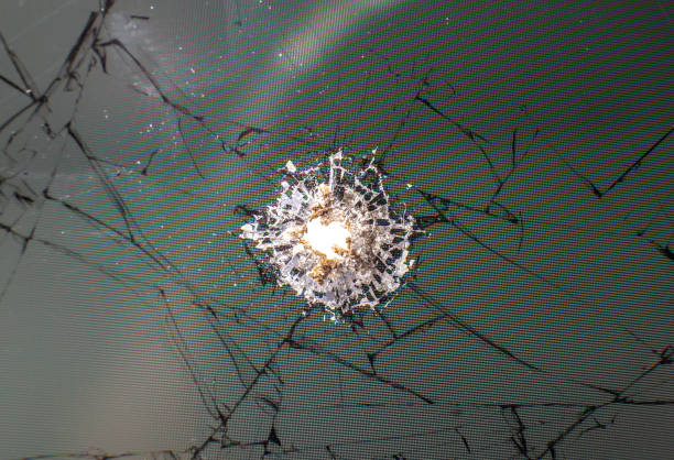 istock Broken glass from bullet. Close up photo texture. 1281006224