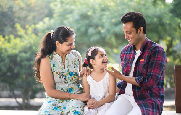 istock Happy family at park 1281009432