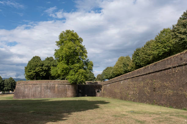 istock Grass in front of the fortress wall in Lucca. 1281010503