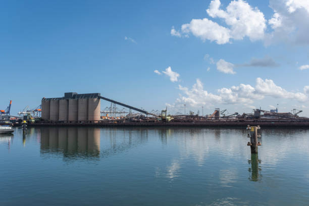 istock Logistics and transportation of Container Cargo ship and Cargo plane with working crane bridge in shipyard and transport industry 1281010542