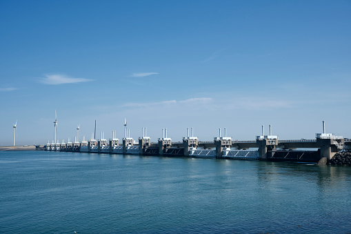 Storm surge barrier in Zeeland, Holland. Build after the storm disaster in 1953. Long shutter speed, waves are flowing.