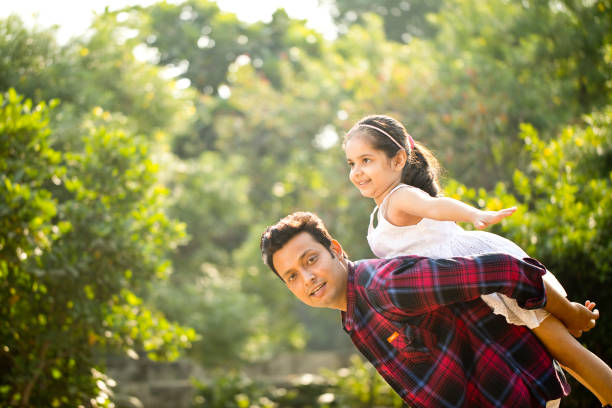 istock Father and daughter enjoying piggyback ride 1281010617