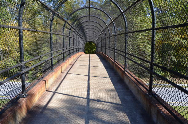 istock path with metal fence over highway or road 1281010644